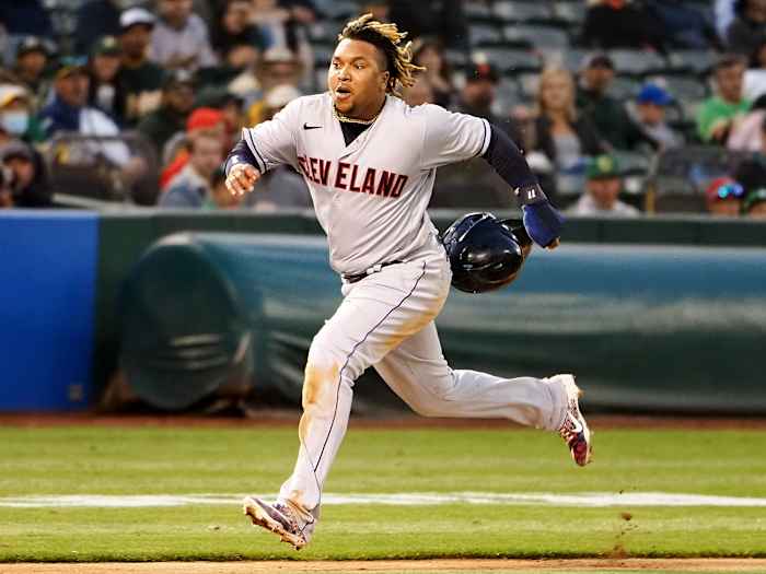 Jul 16, 2021; Oakland, California, USA; Cleveland Indians third baseman Jose Ramirez (11) runs home to score a run against the Oakland Athletics during the sixth inning at RingCentral Coliseum.